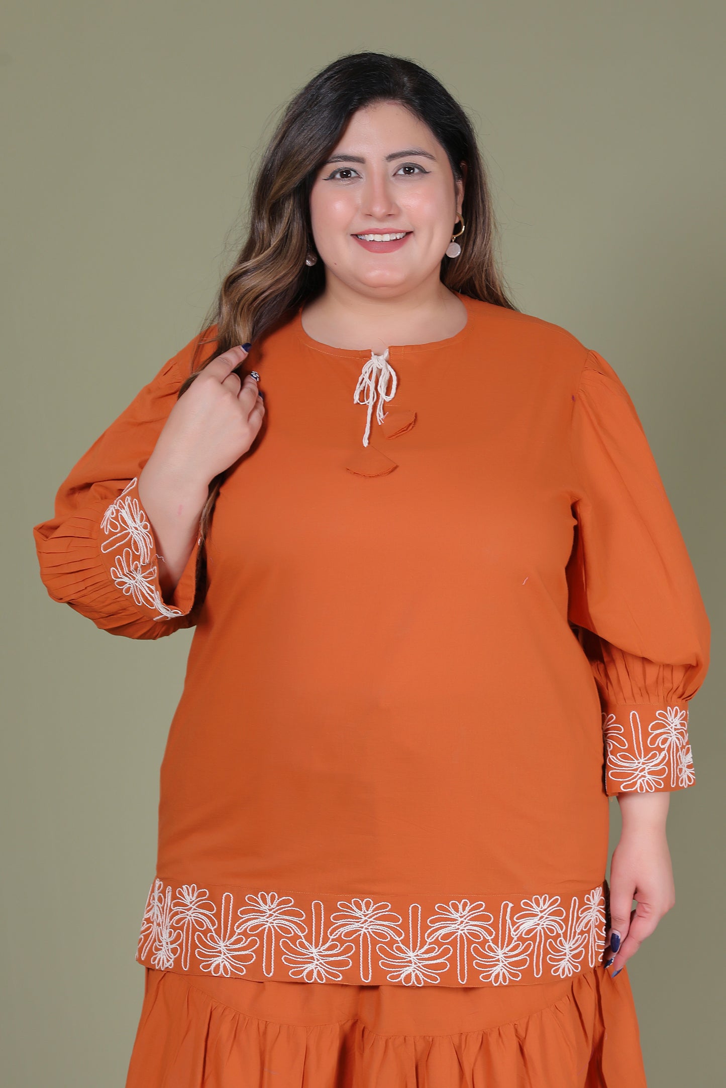SOLID BLOOM EMBROIDERY COTTON TOP IN RUST ORANGE COLOUR BY PLUSSIZEKURTI